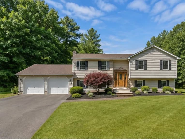 A photograph of a split-level house taken by the agent.
